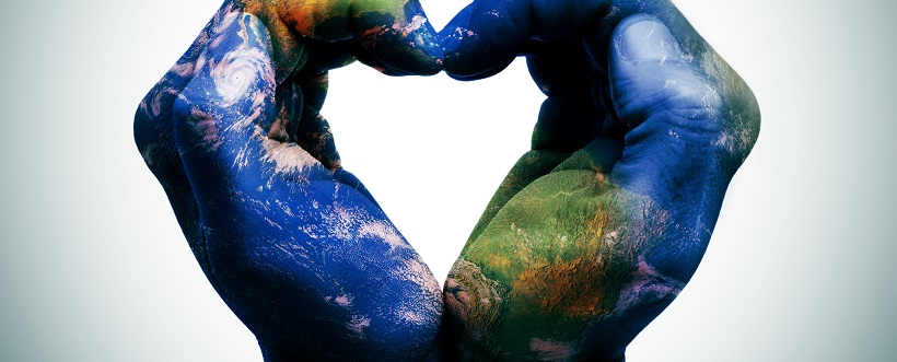 a world map in man hands forming a heart (Earth map furnished by